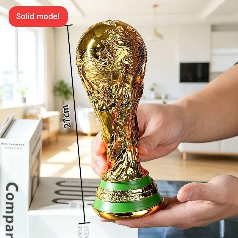 FIFA World Cup trophy with a glossy gold finish and luxurious design.