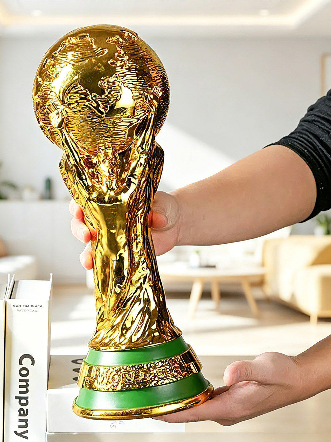 FIFA World Cup trophy with a glossy gold finish and luxurious design.